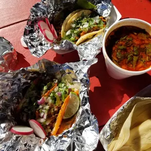 Birria tacos,  chicken tacos, dipping sauce and chicken tamales