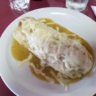 Carne Asada Burrito: Rice, refried beans, asada inside. Covered in chile verde sauce and cheese.