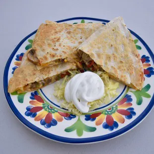 Fajitas quesadilla onions bell pepper mushrooms cheese chose of meat lettuce sour cream on the side