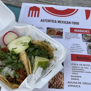 One pastor and one carne asada taco.