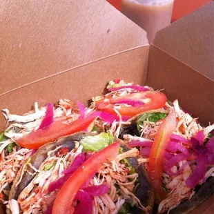 Standard panuchos. Chicken, refried beans, pickled onions, lettuce, and tomato. Habenero lime sauce too