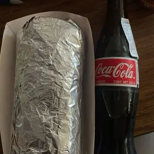 Carne asada burrito and a Mexican coke. Size reference, big sized burritos!!