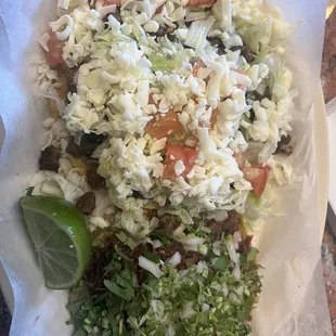 Carne asada tostada on top  Barbacoa taco on bottom- must have it!