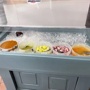 a variety of condiments on ice