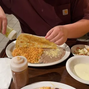 a boy eating a taqueria
