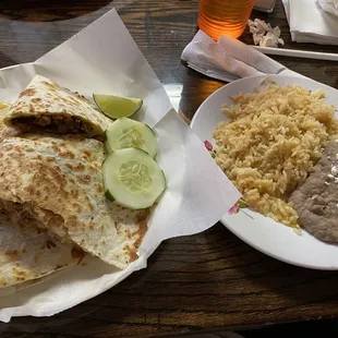 Al pastor quesadilla with rice and beans