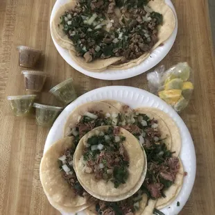 Asada tacos and carnitas tacos 6 each on plates