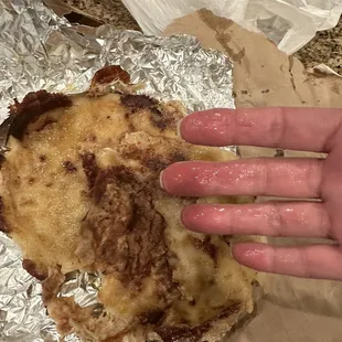 That&apos;s grease on my hand from the pork, cheese &amp; bean pupusas.  It&apos;s also torn apart...that&apos;s how I got it. A mess.