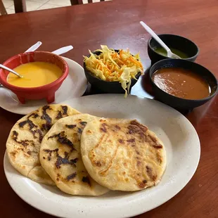 Chicken and pork and cheese pupusas. Side of Cabbage.