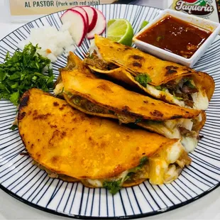 QuesaBirria Taco comes with Consome on a side.