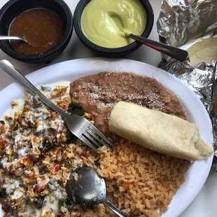 Huevos a la Mexicana, topped with cheese dip. Too good! Love the handmade tortillas and the salsa verde as well.