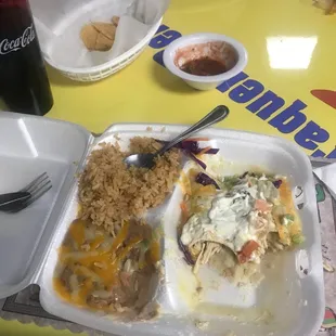 Chicken enchiladas with green sauce. World's best salsa in the background there!