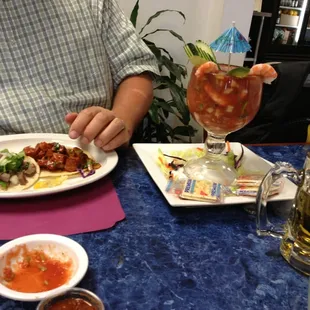 Shrimp cocktail, and , lengua y al pastor tacos