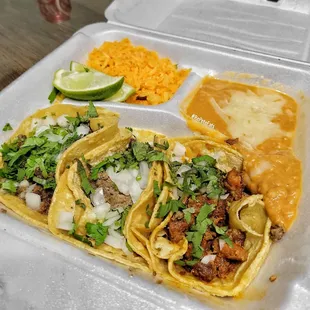 two tacos in a styrofoam container