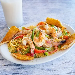 a plate of food and a glass of milk