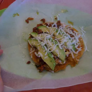 chorizo tostada, with avacado and white cheese