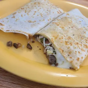 a taqueria burrito on a yellow plate