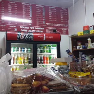Inside...cluttered.  Typical Mexican joint trying to be a restaurant and a grocery store. Stuff all over the counter.