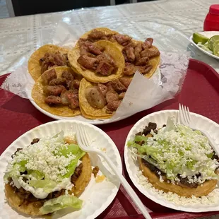 In this photo is one sope de pastor and one of asada and 6 tacos de tripa