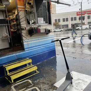 a scooter parked in front of a store