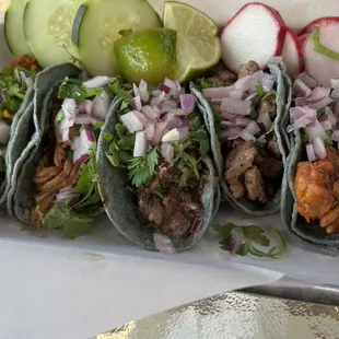 5 different meats on these tacos.  Great blue corn tortillas.