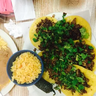 4 mini tacos. Carne Asada w no onion. No charro beans just rice. Yummy.