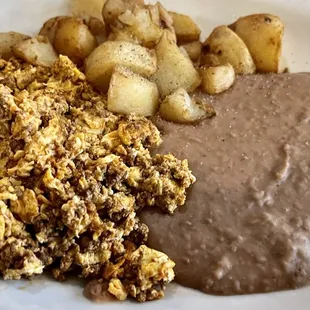 A required breakfast if you&apos;re ever in S Texas. Tasty chorizo &amp; eggs, refried beans and fried potatoes. The BEST!