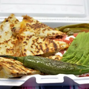 a meal in a styrofoam container