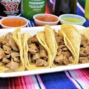 a plate of chicken tacos