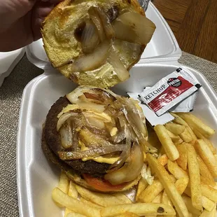 Burger with top bun off showing grilled onions and cheese!