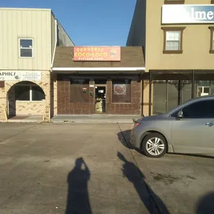 the shadow of a person in a parking lot