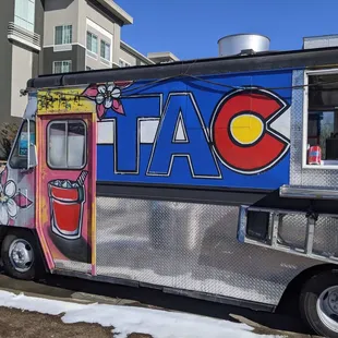 a taco truck parked on the side of the road