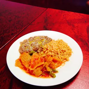 Chicharron with a side of beans and rice