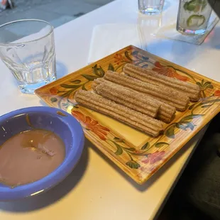 Churros dipped in caramel