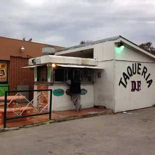  a taqueria with graffiti on it