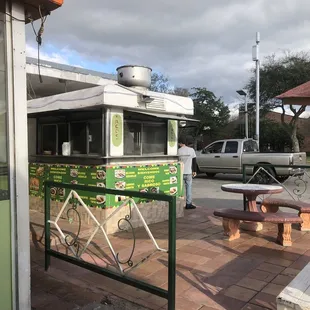  a taqueria on a street corner