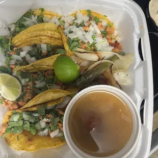 4 chicken tacos with pinto beans on the side