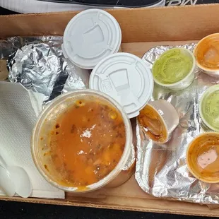 Our to-go bounty. Charro beans, several tacos, and a big tub of menudo. The worker kindly boxed it up for us