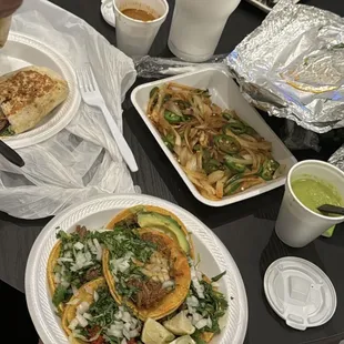 a variety of tacos and drinks