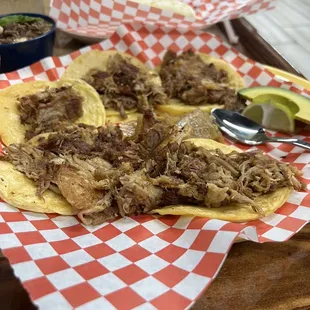 a plate of pulled pork tacos