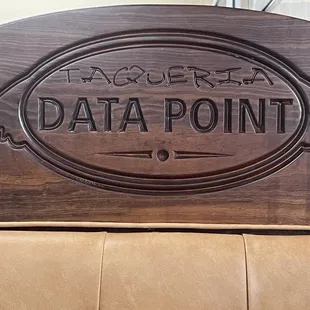 a close up of a wooden sign