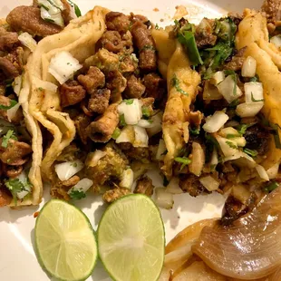 (2) Tripa, Al Pastor and Chicken Tacos.  Side of grilled onion