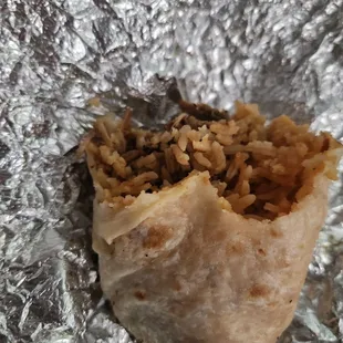 Last 1/4 of a carnitas burrito. So big, half for lunch then half for dinner.