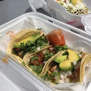 Tres tacos and hot sauce. Al pastor, barbacoa, and steak