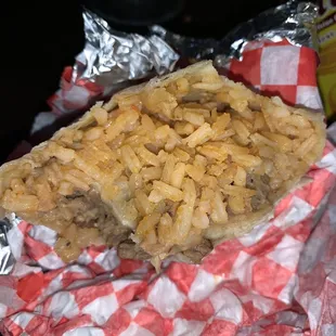 Carne asada burrito with mostly rice and low quality meat