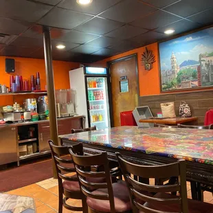 a table and chairs in a restaurant