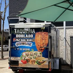 a food truck parked on the side of the road