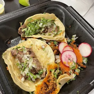 two tacos on a tray