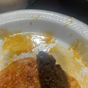 Meat looks disgusting no cheese  and horrible customer service It's The Second Time I asked for Taco birrias and this is what I get.