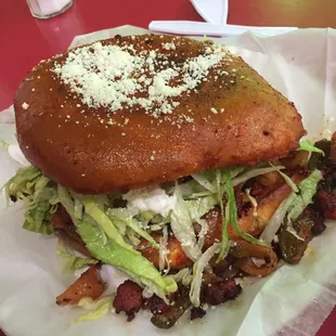 a taqueria sandwich on a napkin